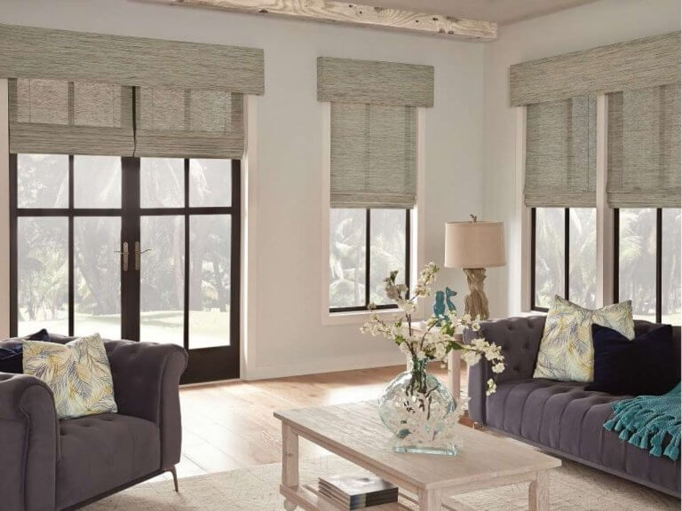 In main living areas, custom woven shades add warmth and texture while allowing natural light to filter in.