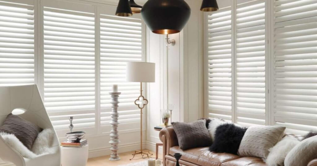 Plantation shutters can complement modern interiors. Their clean lines, customizable finishes, and wide louvers allow them to blend seamlessly into minimalist, contemporary, or transitional designs.